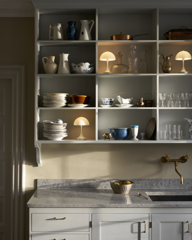Panthella 160 Portable casting warm light inside kitchen cabinet, © 2025 Louis Poulsen.
