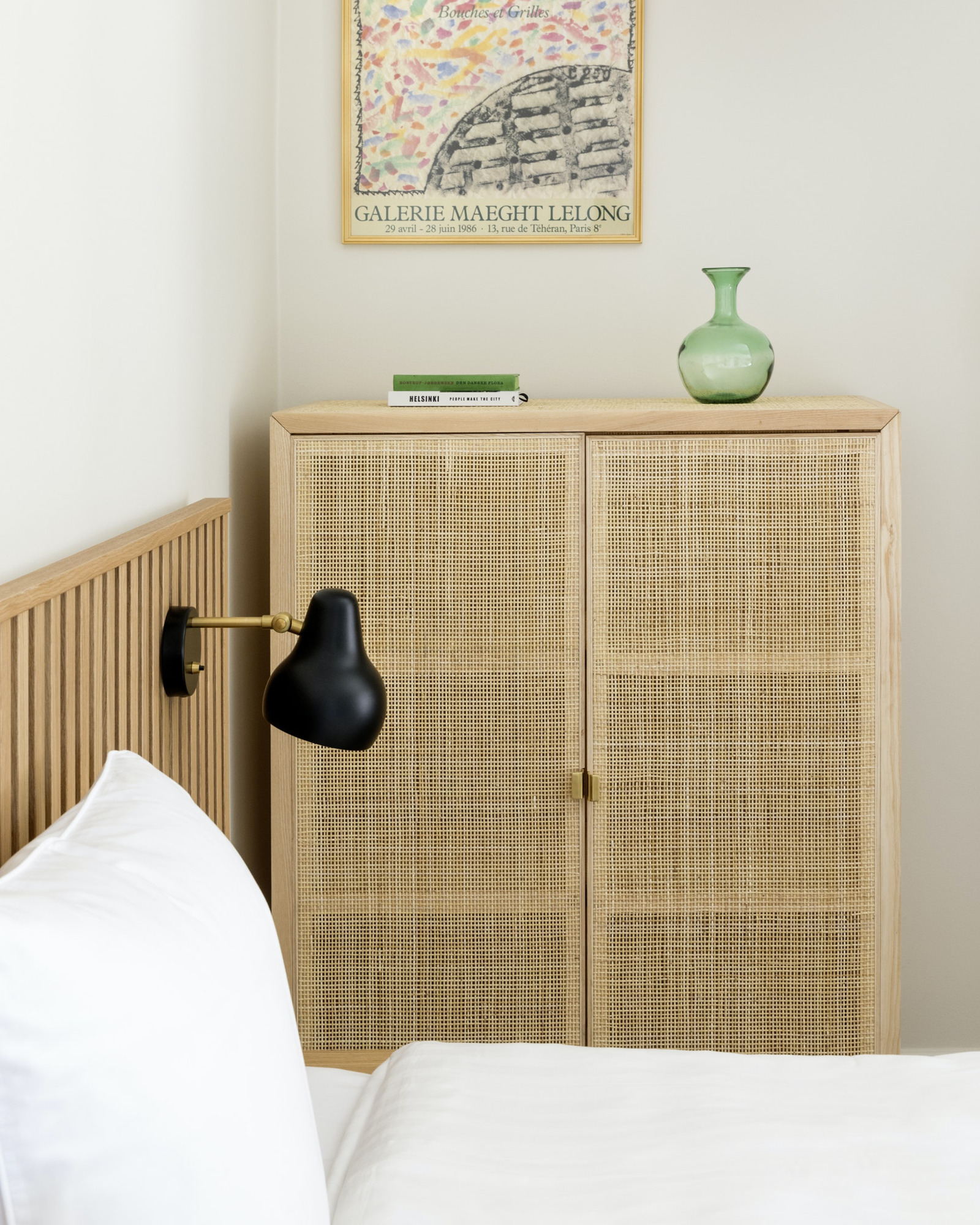 VL 38 Wall in Black beside bed in bedroom, © 2025 Louis Poulsen.